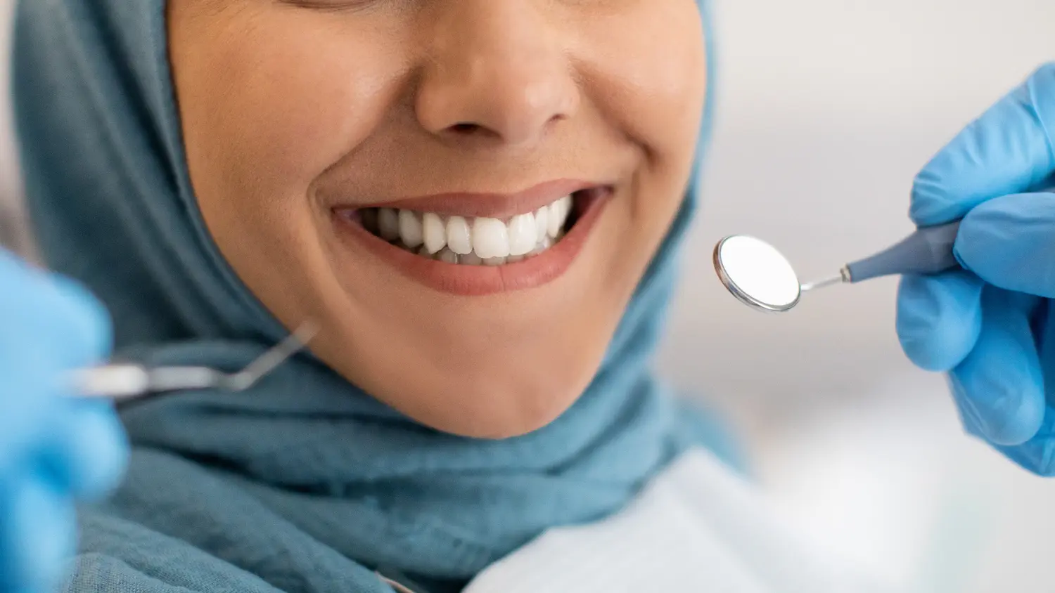 Patient smiling during a dental examination